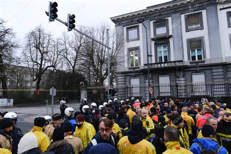 Police Officers Stand Guard As They Obstruct The Firefighters From