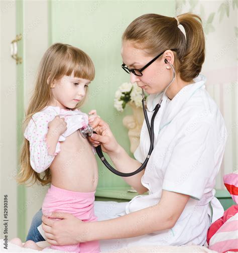 Doctor Examining Girl With Stethoscope Stock Photo Adobe Stock