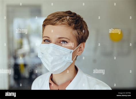 Portrait Of A Confident Female Doctor Wearing Surgical Mask Stock