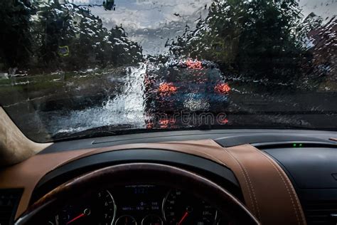 The Car Goes In The Rain View From The Inside Raindrops On The