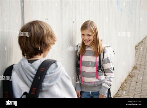 Boy And A Girl Talking In The Schoolyard Stock Photo Alamy