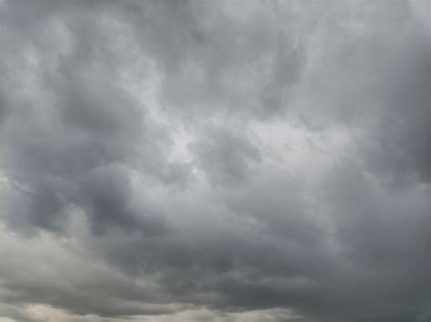 Dramatic Overcast Sky with Grazing Sheep