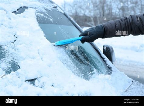 Removing Snow From Car Windshield Closeup Stock Photo Alamy