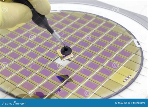 Silicon Wafer With Microchips Fixed In A Holder With A Steel Frame On