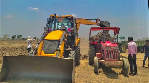 JCB 3dx Backhoe Machine Loading Red Mud In Mahindra 475 Di Tractor