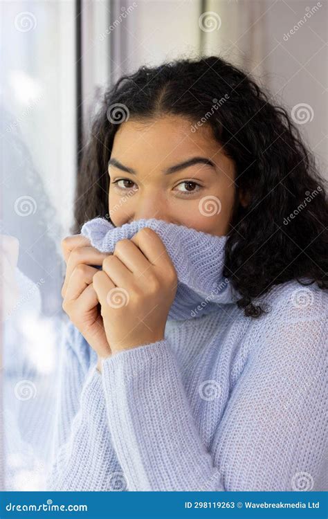 Biracial Woman Covering Herself By Sweater At Sunny Home Stock Image Image Of Summer Happy