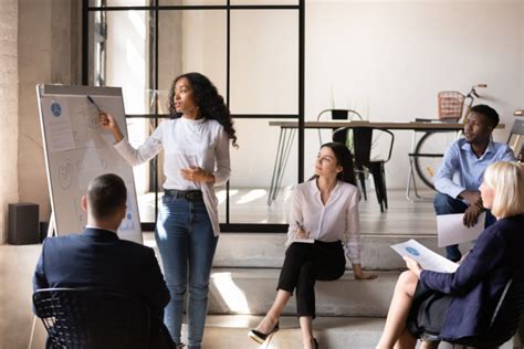 African Businesswoman Manager Give Presentation On Whiteboard At Office