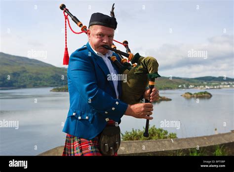 Bagpipe Player On The Scottish Highlands Near The Isle Of Skye Stock