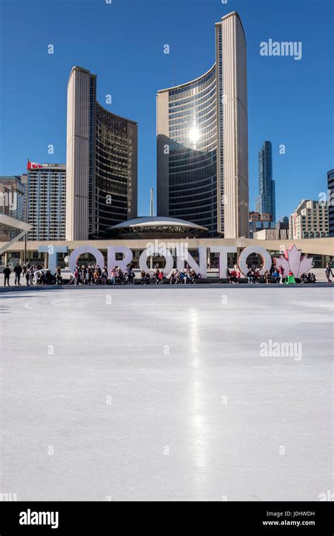 Toronto City Hall, Nathan Phillips Square in winter, ice skating rink ...