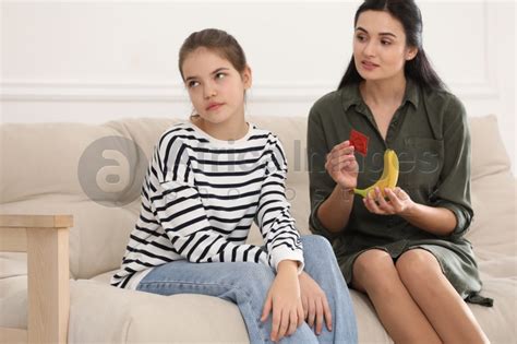 Mother Talking With Her Teenage Daughter About Contraception At Home