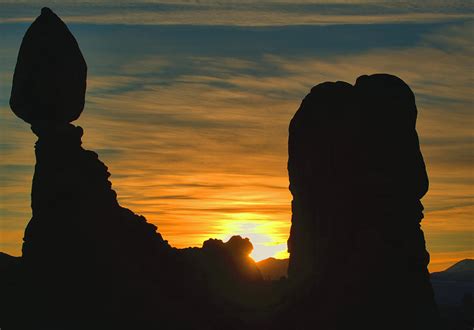 Silhouette Rock Formations At Sunrise Photograph by Stephen Vecchiotti