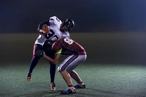 American football players in action 12753961 Stock Photo at Vecteezy