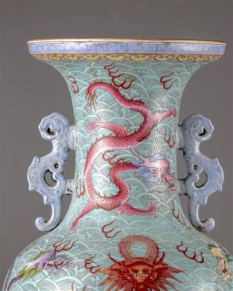 A CHINESE BLUE GROUND FAMILLE ROSE DRAGONS VASE