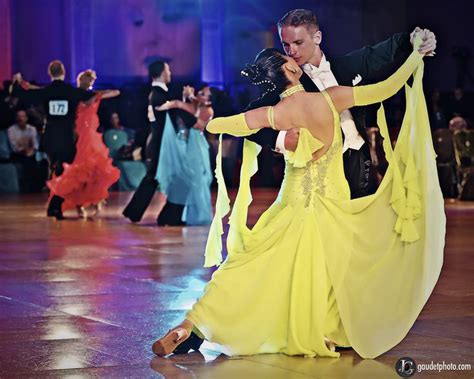 a man and woman dancing on a dance floor