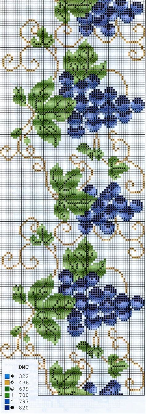 A Cross Stitch Pattern With Blue Flowers On It