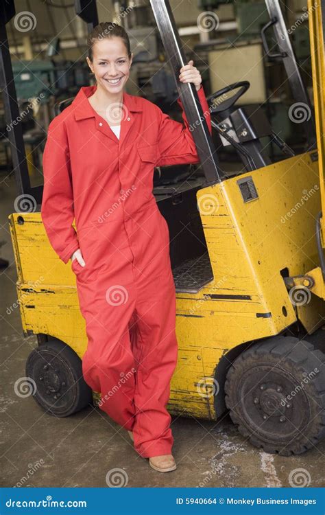 Warehouse Worker Standing By Forklift Stock Photo Image Of Caucasian