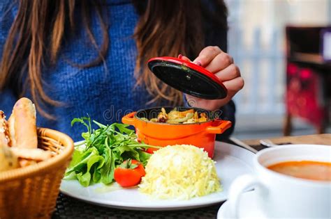 Woman Sitting At Table With Plate Of Food Stock Image Image Of