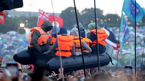 Banksy Claims Migrant Boat Artwork In Crowd At Glastonbury Ents