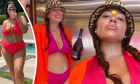 Ashley Graham Flashes Her Tummy In A Purple Bikini Daily Mail Online