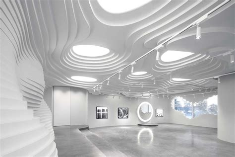 123 architects creates white cave retail and gallery space in Beijing