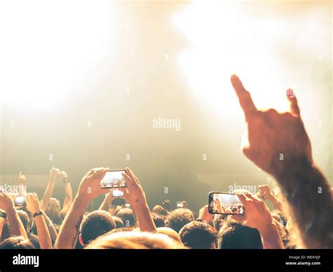 Colourful concert hall with clapping people Stock Photo - Alamy