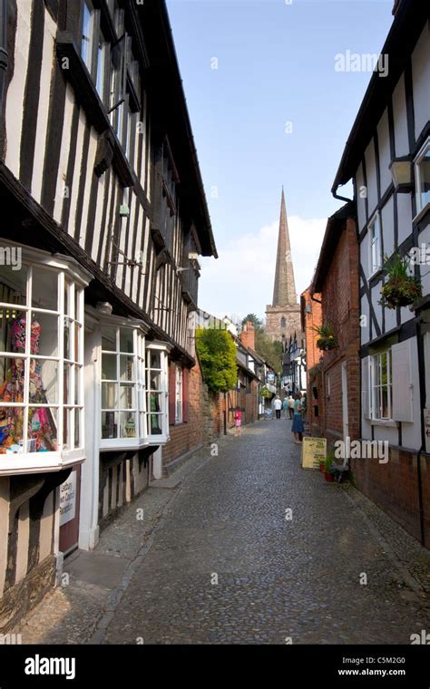 Quaint Narrow Street With Traditional Black And White Timber Framed