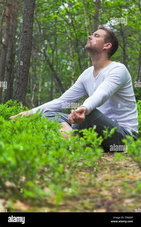 Mid Adult Caucasian Man Sitting Down Outdoors Alone With Closed Eyes