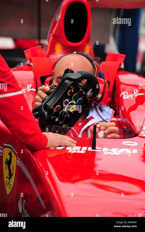 A Ferrari mechanic sitting inside a Ferrari F1 car Stock Photo - Alamy