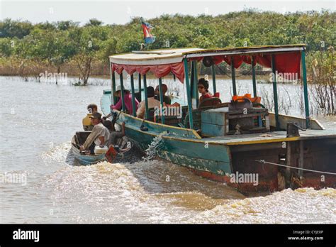 Tourists Boat In The Floating Village Chong Khneas On The Tonle Sap