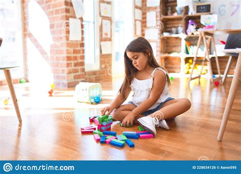 Adorable Toddler Sitting On The Floor Stock Photo Image Of Happy