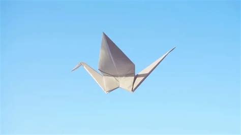 Origami Bird. Flying origami bird on blu... | Stock Video | Pond5