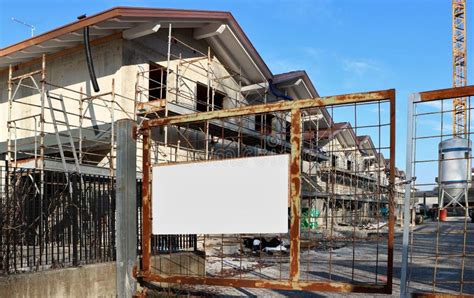 Blank Information Board On A Facade Under Refurbishment At The Roadside