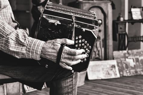 Premium Photo Midsection Of Man Playing Accordion While Sitting Outdoors