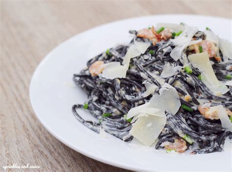 Spaghetti Al Nero Di Seppia With Alfredo Sauce Sprinkles And Sauce