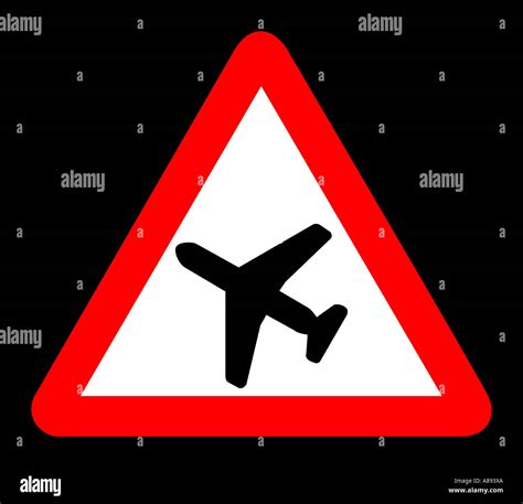 Low Flying Aircraft Road Sign On Black Background Stock Photo