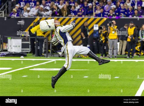 The Michigan Wolverines Drum Major High Steps Down The Field During The