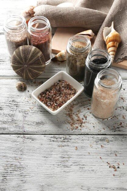 Premium Photo Different Sea Salt On Wooden Table Close Up