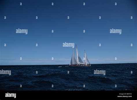 Sailing Boat On Ocean Stock Photo - Alamy