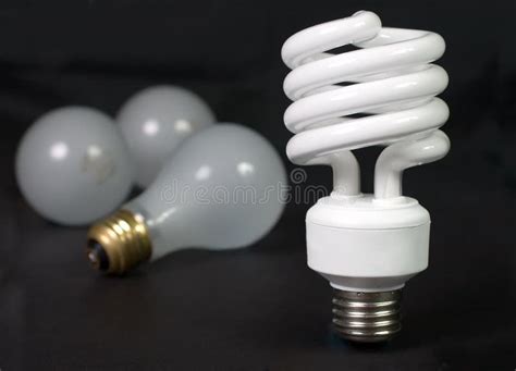 Comparing Fluorescent And Incandescent Light Bulbs Stock Photo Image