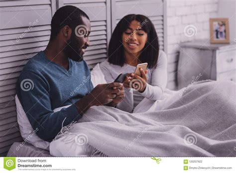 Cheerful Brunette Demonstrating Her Device Stock Photo Image Of Leisure Male 120207922