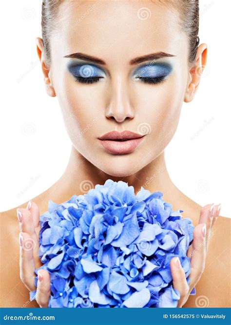 Closeup Face Of Young Beautiful Woman With A Blue Makeup Of Eyes Stock