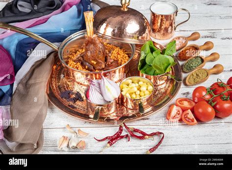 Presentation Of Traditional Turkish Meat Dishes Turkish Foods Lamb Shank Tandoori On Bulgur