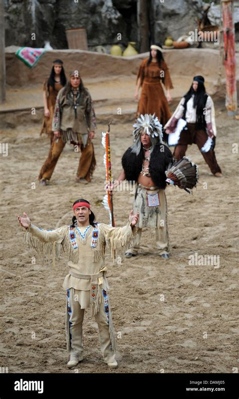 Actor Erol Sander as Winnetou throws his hands into the air during a presentation of 'The Oil ...