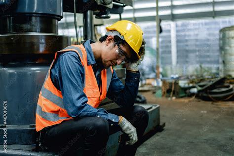 Engineer Or Factory Worker Feeling Tired From Hard Work In A Factory