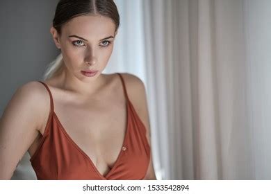 Sensual Beautiful Blonde Woman Posing Red Stock Photo