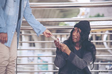 Woman Helping Hands To Homeless People Poverty Beggar Man Holding