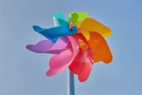 Low Angle Rainbow Pinwheel On Blue Sky Background Stock Photo Image