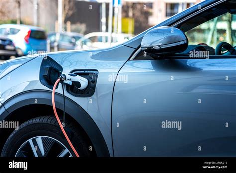 Charging Cable On An Electric Car Stock Photo - Alamy