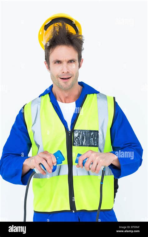 Electrician getting a shock while holding cables Stock Photo - Alamy