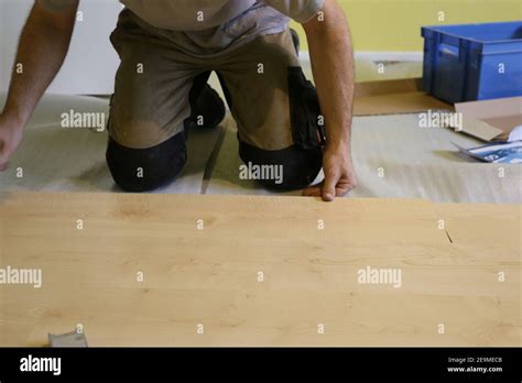 Professional installation of a parquet floor Stock Photo - Alamy